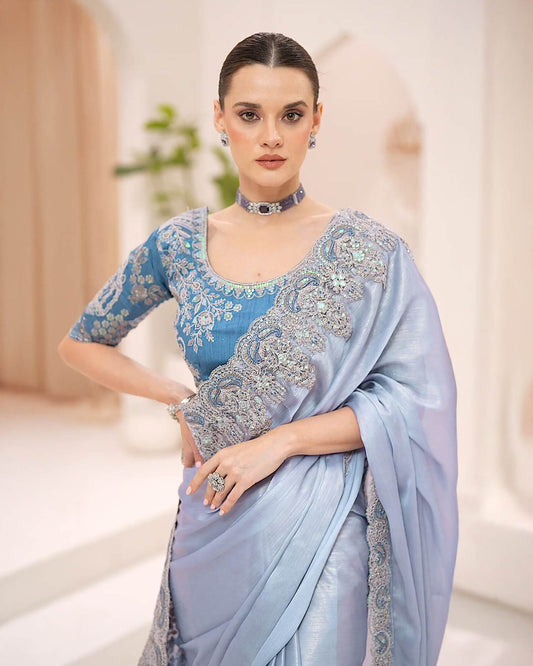 Powder blue silky shimmer georgette saree with metallic sheen and stone embroidery by Rinaz