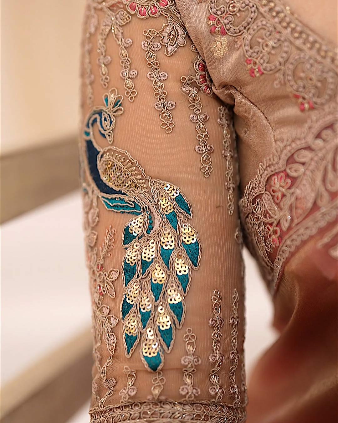 Amber Blush saree fabric texture and golden sheen detail
