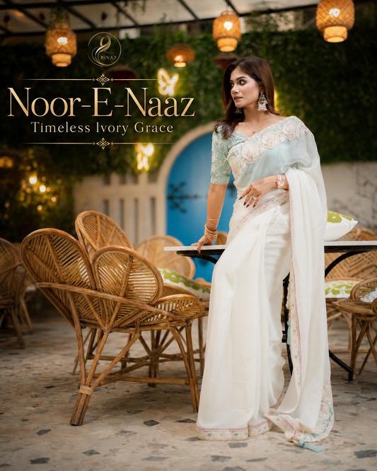 Noor-e-Naz ivory white shimmer georgette party saree with pastel accents by Rinaz