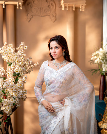 Close-up of hand-painted karchupi and stone embroidery on Nooréline ivory muslin saree