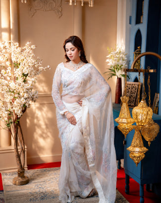 Nooréline saree pallu showing hand-painted floral motifs and karchupi work