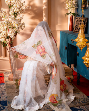 Model wearing Nooréline ivory bridal muslin saree for wedding and reception