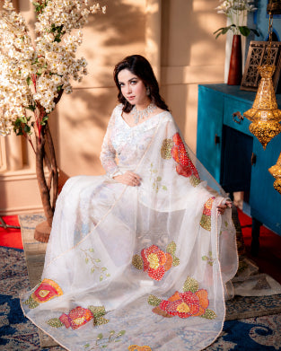 Nooréline soft ivory muslin saree fabric texture and shimmer detail